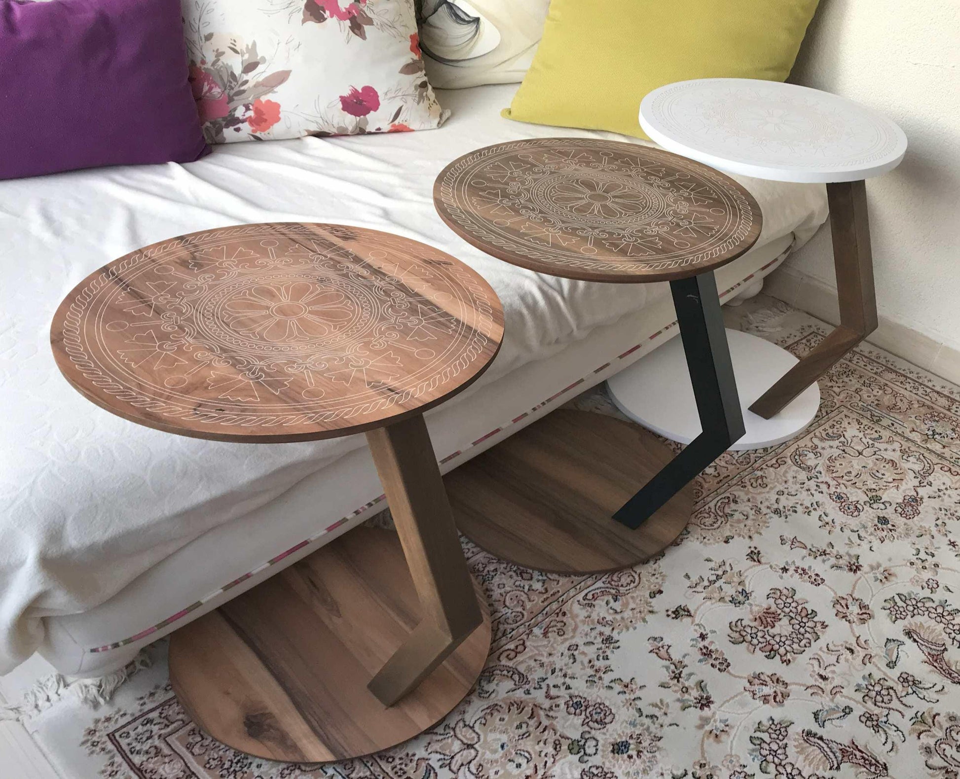 A modern C-shaped side table designed to stay right by their side