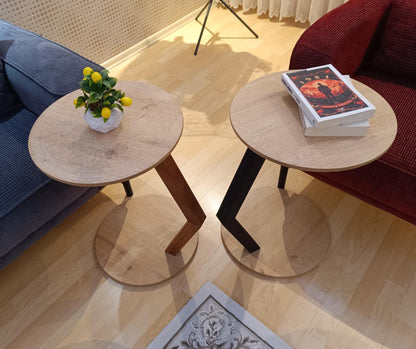 A modern C-shaped side table designed to stay right by their side